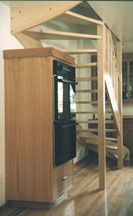 oven cabinet and stairs detail