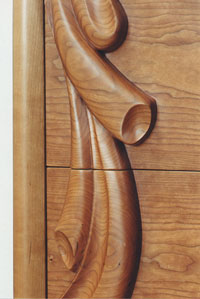 Carved cherry dresser drawer detail