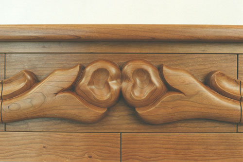 Carved cherry dresser top drawer detail