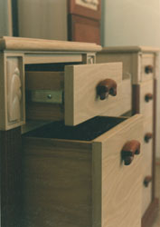 carved purpleheart and white oak vanity drawer detail