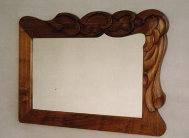 Carved walnut mirror