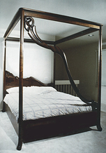 carved walnut canopy bed