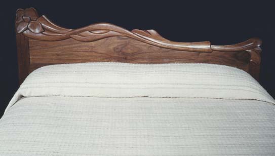 Carved walnut headboard