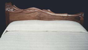 carved walnut headboard
